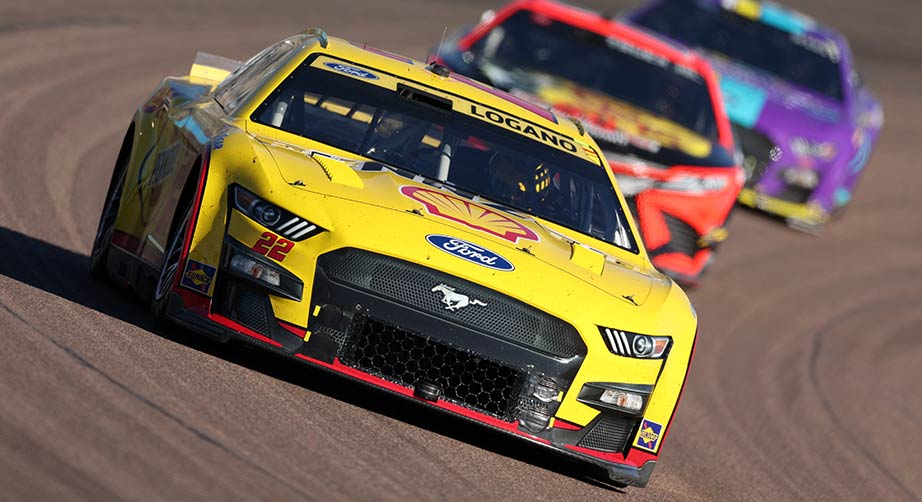 Joey Logano leads Martin Truex Jr. and Cody Ware through the turns at Phoenix Raceway