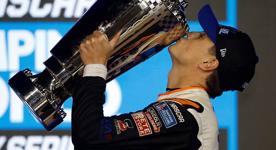 Zane Smith kisses the Truck Series championship trophy