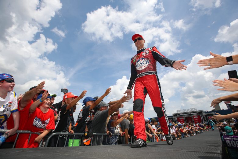 BROOKLYN, MICHIGAN - AUGUST 07: Kevin Harvick, driver of the #4 Busch Light Apple #BuschelOfBusch Ford, greets fans during driver intros prior to the NASCAR Cup Series FireKeepers Casino 400 at Michigan International Speedway on August 07, 2022 in Brooklyn, Michigan. (Photo by Sean Gardner/Getty Images) | Getty Images