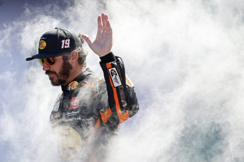 HOMESTEAD, FLORIDA - OCTOBER 23: Martin Truex Jr., driver of the #19 Bass Pro Shops Toyota, waves to fans as he walks onstage during driver intros prior to the NASCAR Cup Series Dixie Vodka 400 at Homestead-Miami Speedway on October 23, 2022 in Homestead, Florida. (Photo by Sean Gardner/Getty Images) | Getty Images