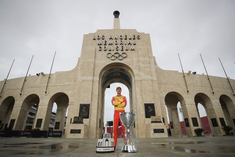 LOS ANGELES, CALIFORNIA - NOVEMBER 08: Joey Logano, driver of the #22 Shell Pennzoil Ford, poses with the Bill France NASCAR Cup Series Championship trophy and his NASCAR Clash at the Coliseum trophy at LA Memorial Coliseum on November 08, 2022 in Los Angeles, California. (Photo by Meg Oliphant/Getty Images) | Getty Images