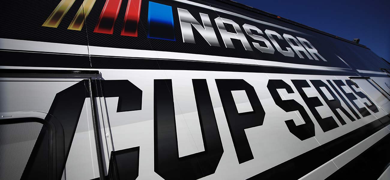 The NASCAR Cup Series logo on the side of the officials' hauler