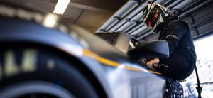 Mike Rockenfeller hops into the Garage 56 test car in the Daytona International Speedway garage
