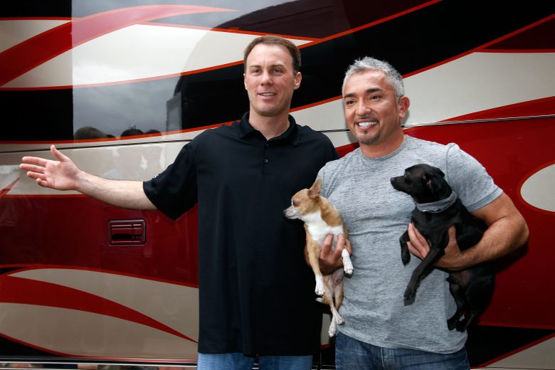 DAYTONA BEACH, FL - FEBRUARY 17: (L-R) Driver Kevin Harvick and Cesar Millan, dog behavior specialist, pose in the Driver/Owner Lot at Daytona International Speedway on February 17, 2012 in Daytona Beach, Florida. (Photo by Tom Pennington/Getty Images for NASCAR)