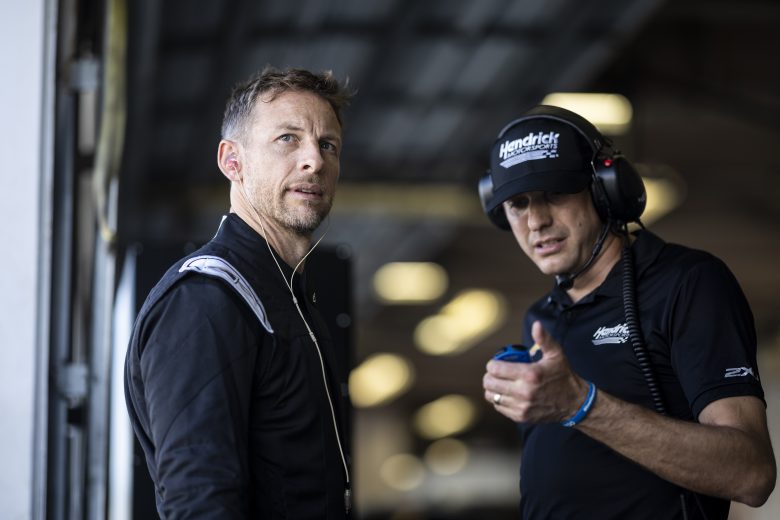 Jenson Button looks on in the garage area during the NASCAR Garage 56 Test at Daytona International Speedway on January 31, 2023 in Daytona Beach, Florida.