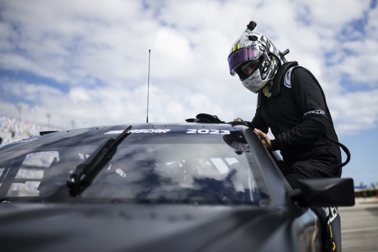 DAYTONA BEACH, FLORIDA - JANUARY 31: Jenson Button climbs in his car during the NASCAR Garage 56 Test at Daytona International Speedway on January 31, 2023 in Daytona Beach, Florida.