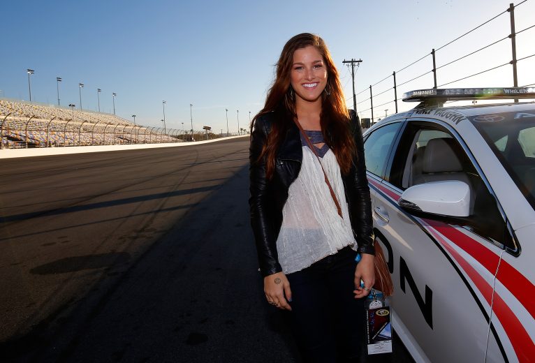 DAYTONA BEACH, FL - FEBRUARY 22: Recording artist Cassadee Pope poses for a photo before taking a pace car ride during the NASCAR Sprint Cup Series 57th Annual Daytona 500 at Daytona International Speedway on February 22, 2015 in Daytona Beach, Florida. (Photo by Chris Trotman/NASCAR via Getty Images)