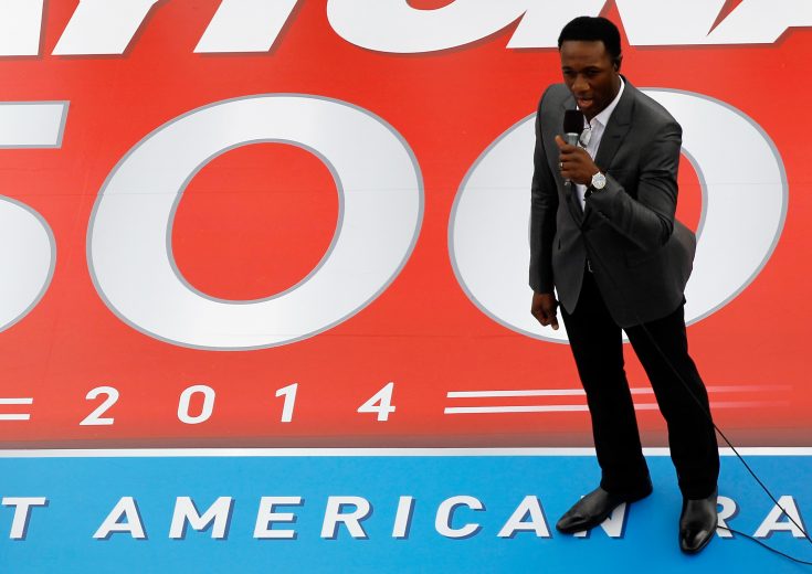DAYTONA BEACH, FL - FEBRUARY 23: Singer and Songwriter Aloe Blacc performs the national anthem during pre-race ceremonies for the NASCAR Sprint Cup Series Daytona 500 at Daytona International Speedway on February 23, 2014 in Daytona Beach, Florida. (Photo by Brian Lawdermilk/Getty Images)
