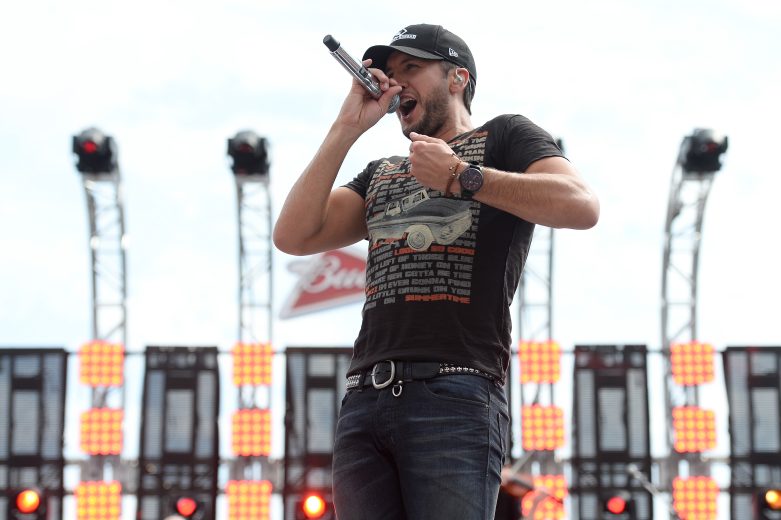 DAYTONA BEACH, FL - FEBRUARY 23: Musician Luke Bryan performs during pre-race ceremonies for the NASCAR Sprint Cup Series Daytona 500 at Daytona International Speedway on February 23, 2014 in Daytona Beach, Florida. (Photo by Jared C. Tilton/Getty Images)