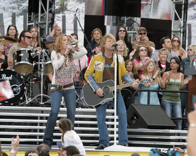 DAYTONA BEACH, FL - FEBRUARY 19: Jon Bon Jovi and Jennifer Nettles perform with Bon Jovi prior to the Daytona 500 February 19, 2006 at Daytona International Speedway in Daytona Beach, Florida. (Photo by Ralph Notaro/Getty Images)