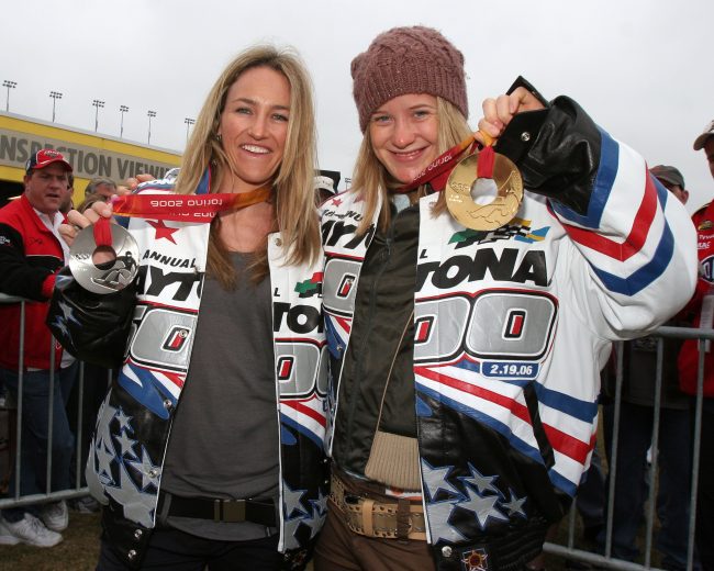DAYTONA BEACH, FL - FEBRUARY 19: Olympic silver medalist Gretchen Bleiler (L) and Gold medalist Hannah Teter pose with their medals in the garage area prior to the Daytona 500 February 19, 2006 at Daytona International Speedway in Daytona Beach, Florida. (Photo by Ralph Notaro/Getty Images)