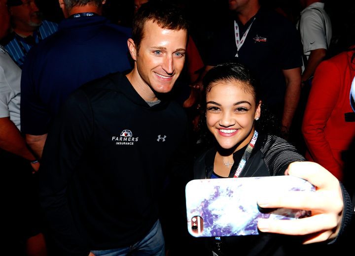 DAYTONA BEACH, FL - FEBRUARY 26: US Olympic gold medalist Laurie Hernandez takes a selfie with Kasey Kahne, driver of the #5 Farmers Insurance Chevrolet, prior to the 59th Annual DAYTONA 500 at Daytona International Speedway on February 26, 2017 in Daytona Beach, Florida. (Photo by Sean Gardner/Getty Images)