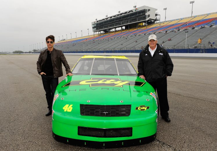 DAYTONA BEACH, FL - FEBRUARY 15: (L-R) Actor Tom Cruise poses with team owner Rick Hendrick next to the car used in the film