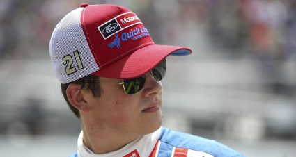 Harrison Burton looks on while he walks down pit road.