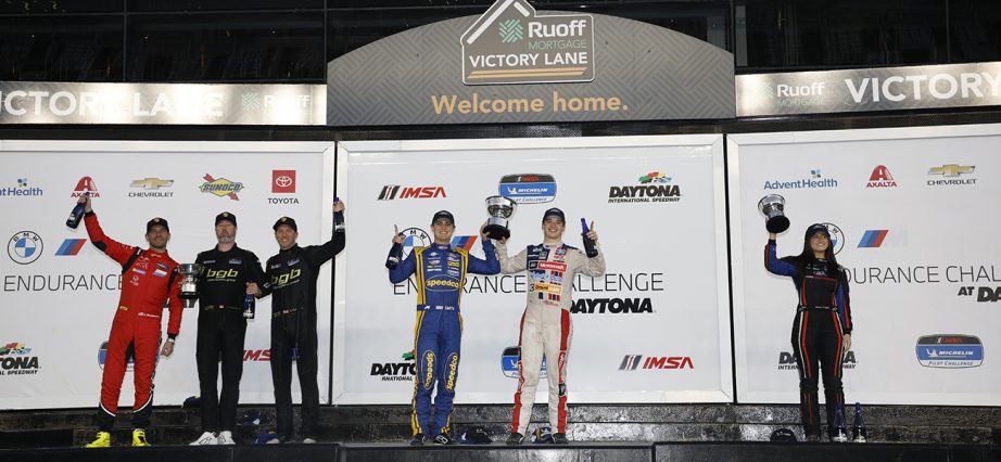 The Michelin Pilot Challenge podium celebrates in Victory Lane