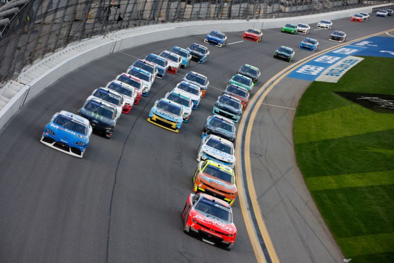allgaier leads a pack of cars