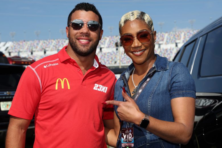 Bubba Wallace and Tiffany Haddish pose for a photo