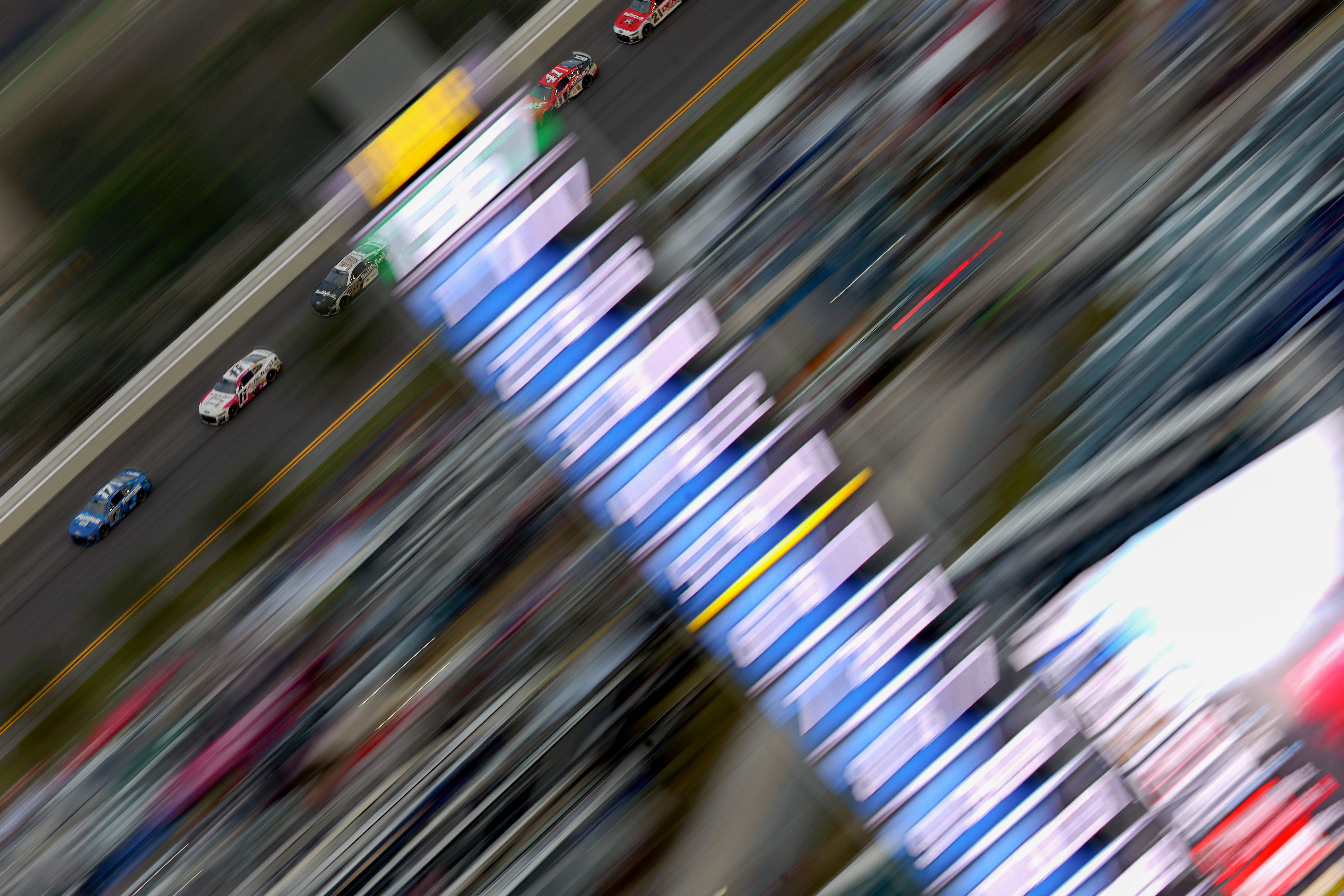 DAYTONA BEACH, FLORIDA - FEBRUARY 19: Chris Buescher, driver of the #17 Fastenal Ford, leads the field during the NASCAR Cup Series 65th Annual Daytona 500 at Daytona International Speedway on February 19, 2023 in Daytona Beach, Florida. (Photo by Mike Ehrmann/Getty Images)