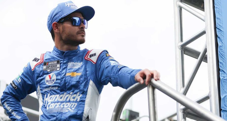 Kyle Larson looks out from the stage area at Daytona