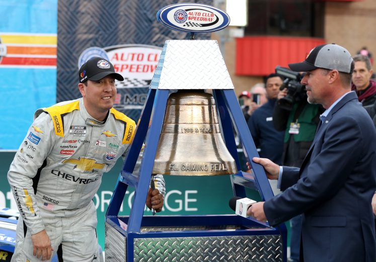 Kyle Busch rings the bell in Victory Lane at Auto Club Speedway