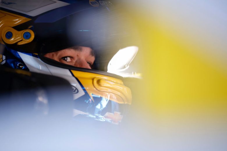 Chase Elliott sits in his car