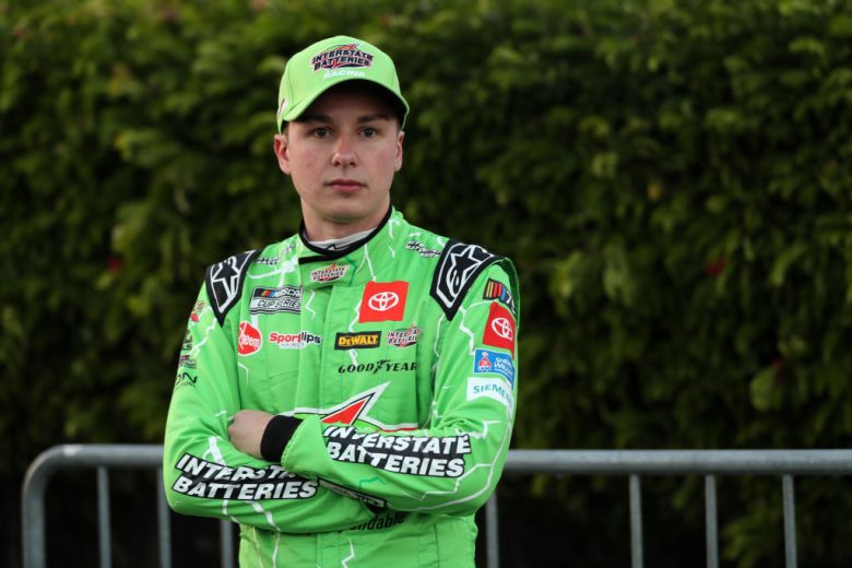 Christopher Bell looks on