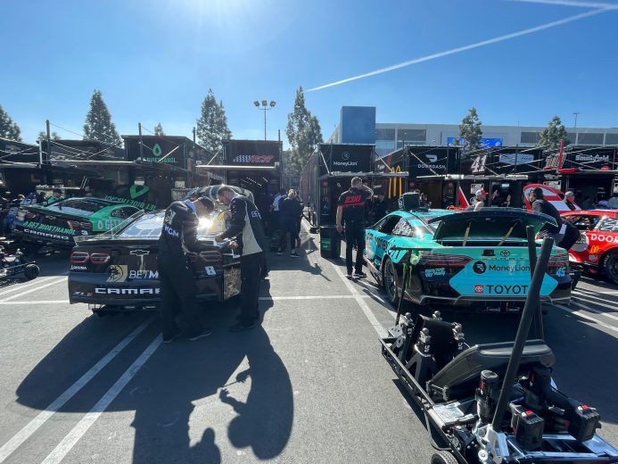 Teams work on cars before Busch Light Clash at The Coliseum practice