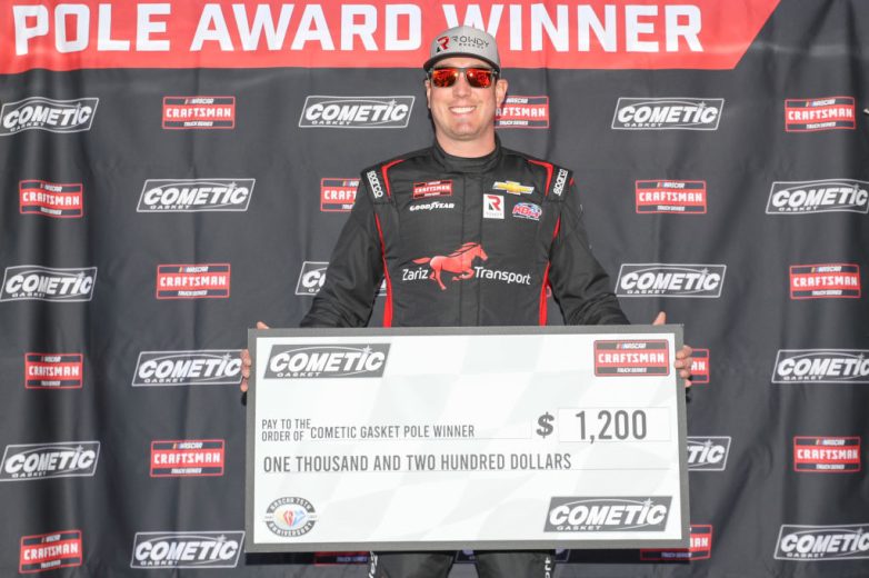 Kyle Busch poses with Truck pole award