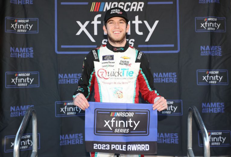Chandler Smith poses with Xfinity pole award