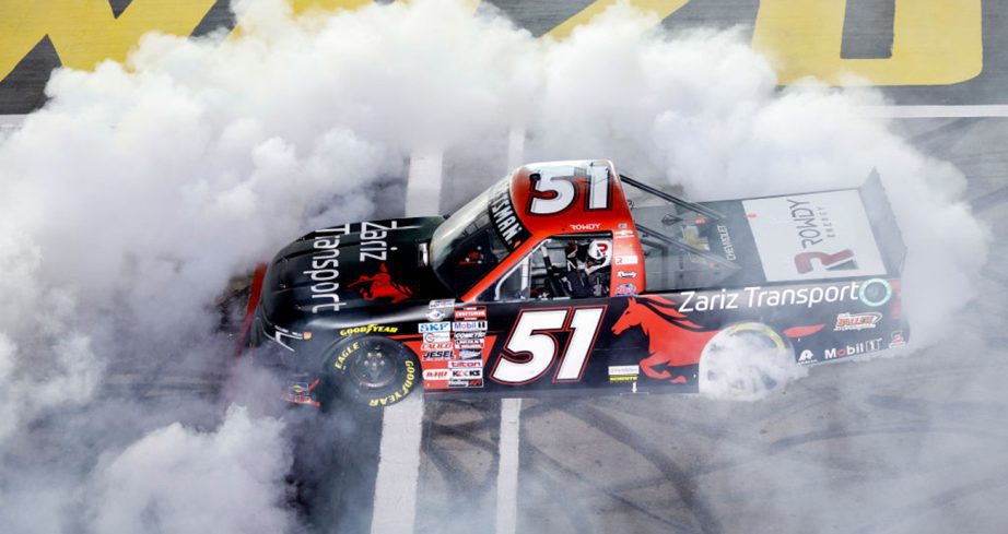 Kyle Busch performs a burnout