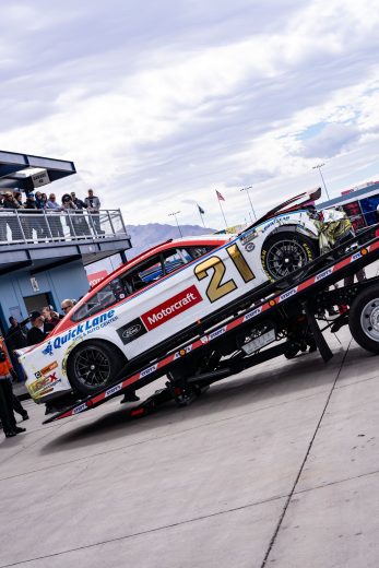 Harrison Burton's No. 21 Ford gets towed to the garage after a wall collision during practice.