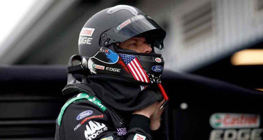Brad Keselowski works on his helmet at Phoenix Raceway.