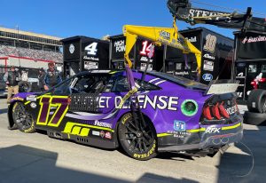 Chris Buescher's car gets towed back to the garage