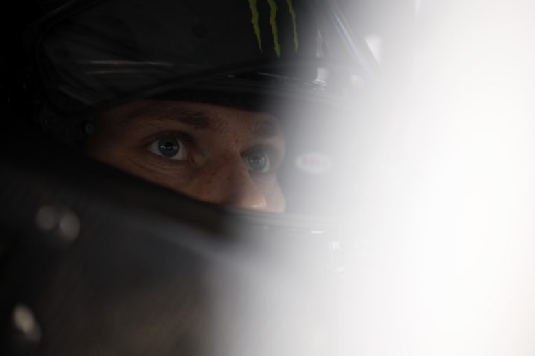 Riley Herbst sits in his car with his helmet on