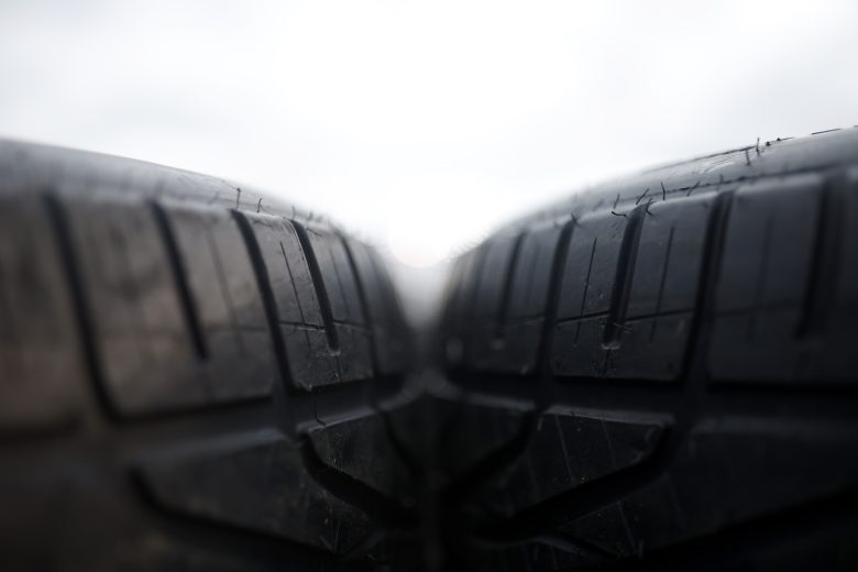 Wet-weather tires sit ready on pit road