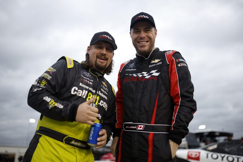 Josh Williams and Alex Labbe smile together on pit road