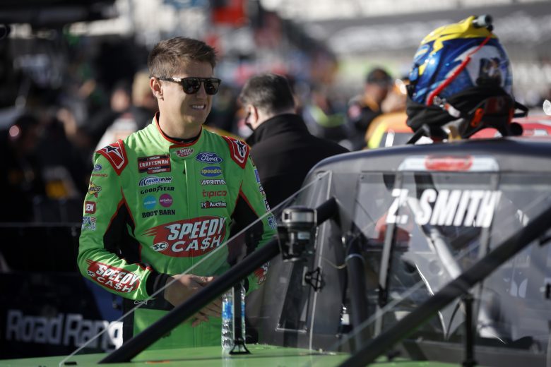 Zane Smith stands next to his truck on pit road at Texas
