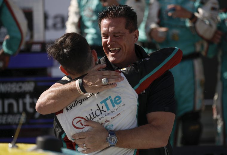 Chandler Smith and Matt Kaulig share a hug in Richmond's Victory Lane