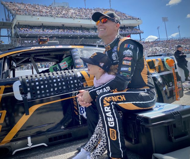 Kevin Harvick sits and smiles with daughter Piper on the grid at Richmond
