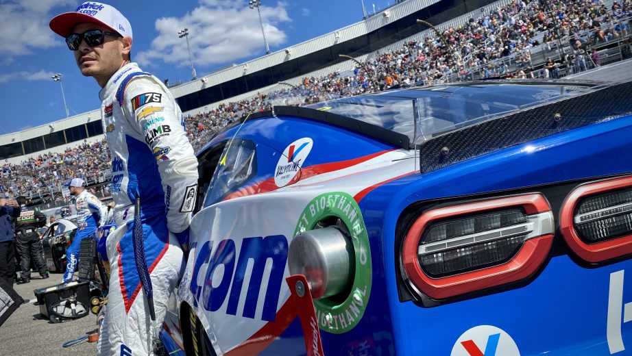 Kyle Larson stands on the Richmond grid