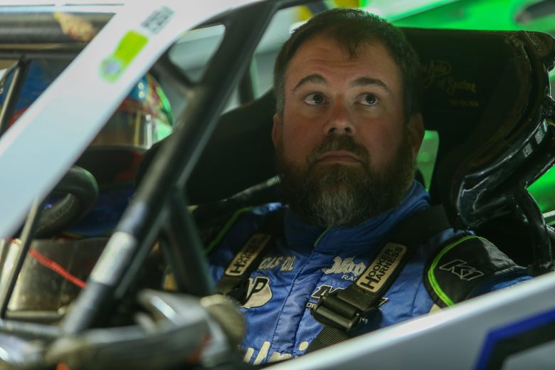 Jonathan Davenport looks onward from inside his car.