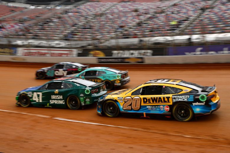 Cup cars drive on Bristol dirt