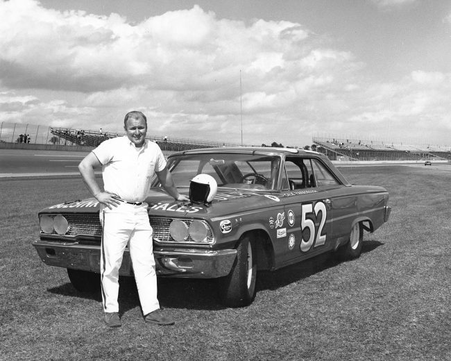 DAYTONA BEACH, FL - FEBRUARY 1963: Cale Yarborough poses with Julian BuesinkÕs Ford that he drove to a 20th-place finish in the Daytona 500 at Daytona International Speedway. (Photo by ISC Images and Archives via Getty Images)