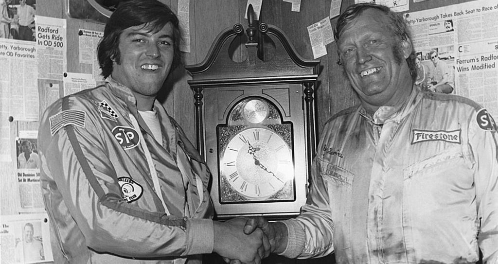 Ron Bouchard and Ray Hendrick pose with the Martinsville clock in 1974 after winning in the NASCAR Modified and NASCAR Late Model sportsman races.
