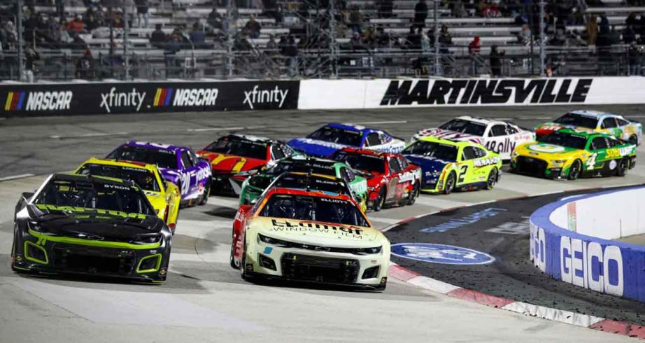 NASCAR Cup Series cars race at Martinsville Speedway.