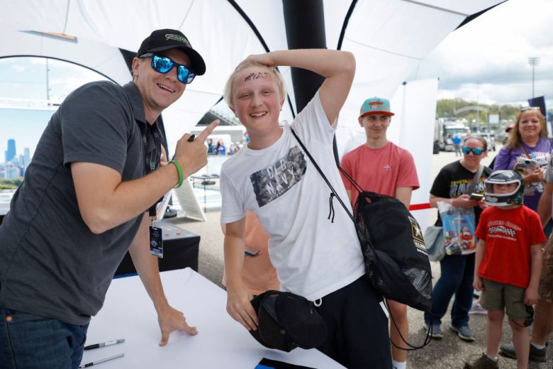 Joey Gase poses with fans.