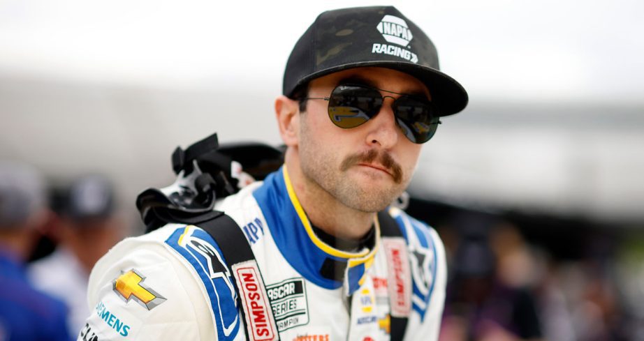 Chase Elliott climbs into his race car at Martinsville