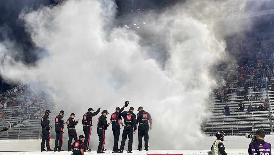 John Hunter Nemechek's team looks on after burnout.