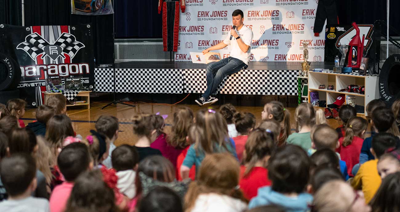 Erik Jones reads to children at Byron (Mich.) Elementary School