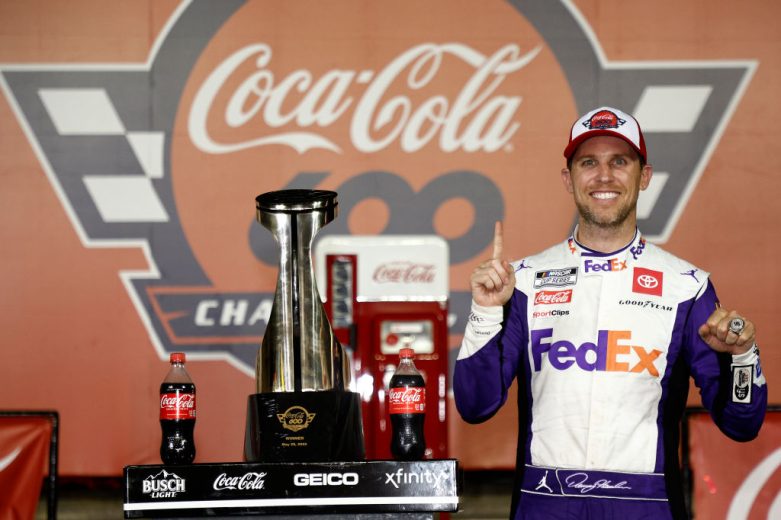 Denny Hamlin celebrates in Victory Lane